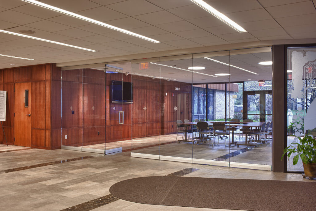 Divide foyers with AVA folding stacking trimless glass partitions by Kwik-Wall